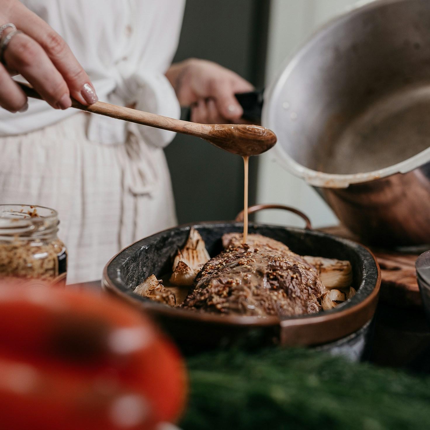 Diverse group of community members sharing a meal, showcasing the bonds formed through collaborative cooking